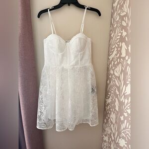 Lulus mini white dress with floral lace detail.